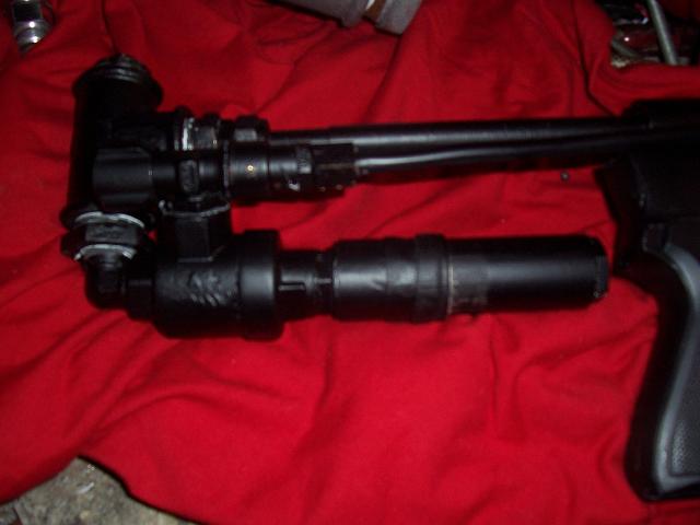 Hard to see but gas enters from the right, though a 90 degree adjustable valve, enters the QEV, wehre the snapvalve sets it off.Air travels up and enters the bb reservoir, located at the very back of the stock.Entry hole is 4 mm.