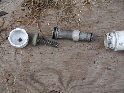 Light saber valve parts.  Small bumper, big spring and huge heavy piston.  An early design that didn't break PVC pistons.  Way too slow to do that.