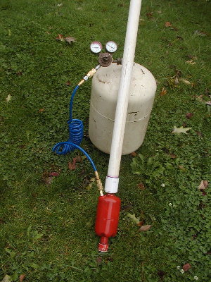 The field kit is the propane tank and a welding regulator with a quick connect added.  I tried to remove the inlet POL fitting but failed.  That is why the regulator has ugly wrench marks. :(   I was going to simply put a quick connect on it so I could simply connect it to my compressor.  With the small cannon and low pressure I got lots of shots  :D