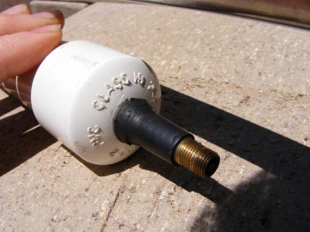 Schrader in end-cap.