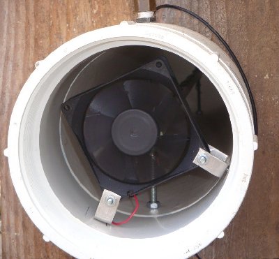 The chamber fan with spark gap farther back in the chamber.  The propane inlet is the brass fitting on top of the chamber.