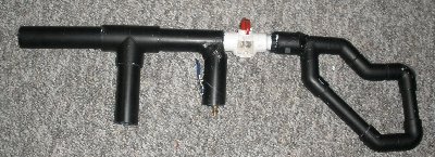 the gun with a silencer and stock attached