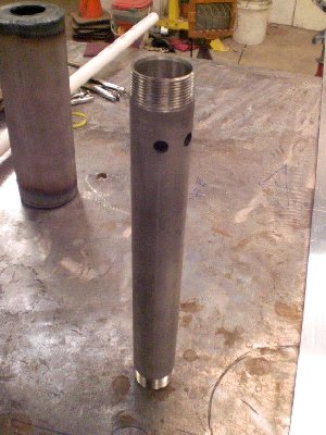 Stainless steel valve body port holes drilled.