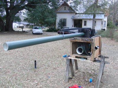 Barrel support (black with silver hanger) on top of the gun/carriage assembly.