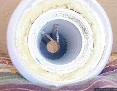 This is a shot inside of the STAG1 chamber. You can see the expanding foam between the chamber and the chamber shell. Also not the ABS reducer and the rusting sharpened electrodes.