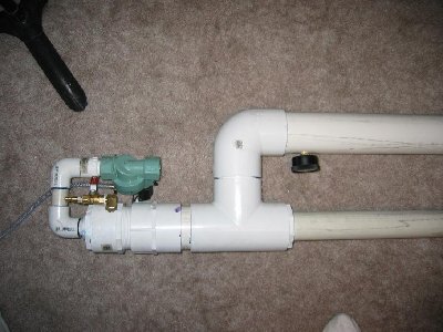 Back of gun. filler valve. gauge is visible on the right