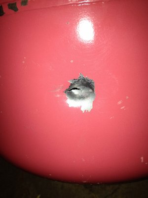 .22lr bullet fired at empty &amp;quot;party time&amp;quot; disposable helium tank