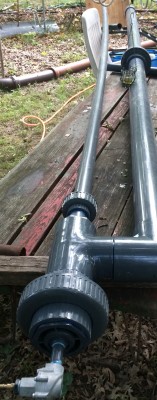 Cannon on table, aimed at plywood for first test.