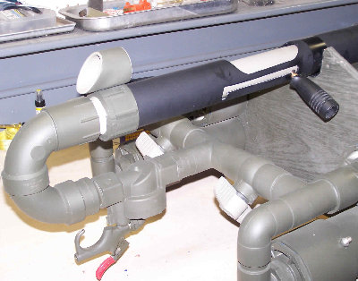 A shot of the side selectable tank shut offs and trigger, With breech and rear ghost ring sight.