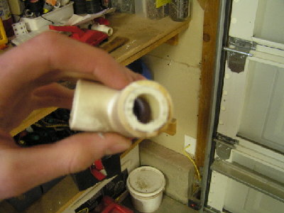 A picture of the fitting and pipe I'm about to separate.  This fitting is ANCIENT, small, and slightly burnt so it gets a small break in it during the process.  On larger pipe this works quite a bit better and having a not-so-damaged fitting would also help.