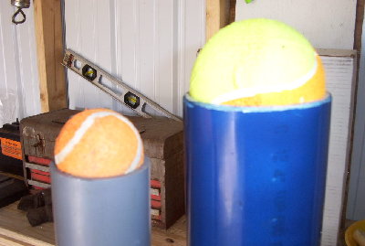 This picture gives a comparison of the bigger ball to a tennis ball. the smaller ball is not really a tennis ball but it is the same size.