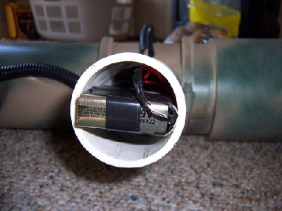 Power supply housed inside of trigger handle.  3 9v batteries.