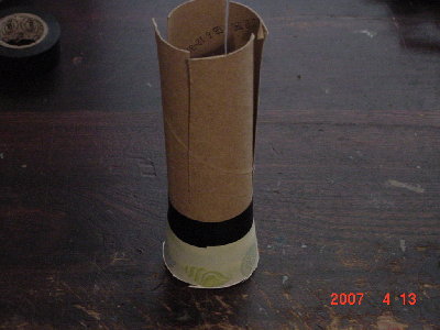 This is the grenade shell.All that is done is to turn a bath cup upside and tape it to the bottom of the toilet paper roll.Then cut the top ring off of the cup to fit into a 2&amp;quot; barrel.Finally cut the toilet paper roll in to 4 even sections.