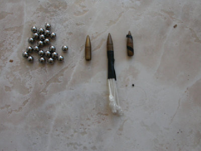 Ammo (left to right):Steel BB's, .224 FMJ, .224 FMJ with stabilising tail, .224 FMJ with tape 'rifling' to induce spin