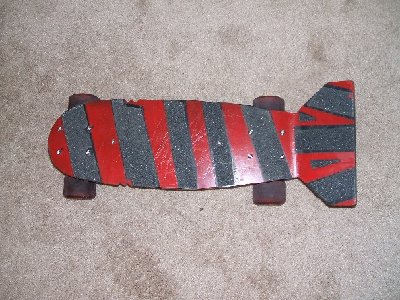 A mini-board! It's almost 20&amp;quot; long, made from 3/8&amp;quot; solid ABS sheet. This shot only really shows the grip tape and red paint.