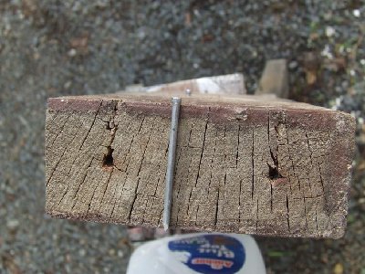 Thickness of wood compared to length of nail in dart.