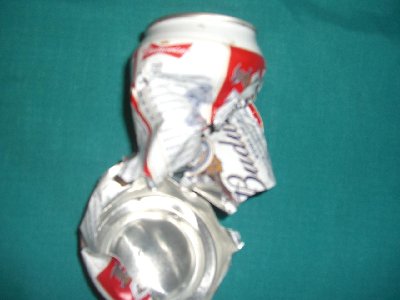 heres a damge to a beer can not mines my dads o.o im only 13 lol