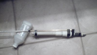 Its blury but you can see the check valve the brass and aluminum barrel, near the back it the bolt, right now instead of a spring I have 4 rubber bands tightened (for now)