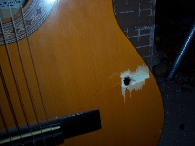 And the exit hole..The guitar was no problem for the marble.I can't wait to try this with a full hopper and a bottle'full of gas!( I'm scared to try actually)