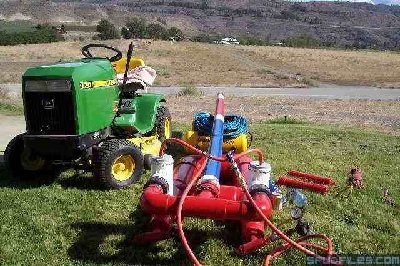Here the range out of my house.<br /><br />There is a white pile of rock above the barrel. A bridge is in front of the rock pile.<br /><br />It is exactly 1/2 mile from the street in front of my cannon to the<br /><br />bridge. It's reachable with golf balls.<br /><br />The bottles make the river about 400 yards away at the green tree line.